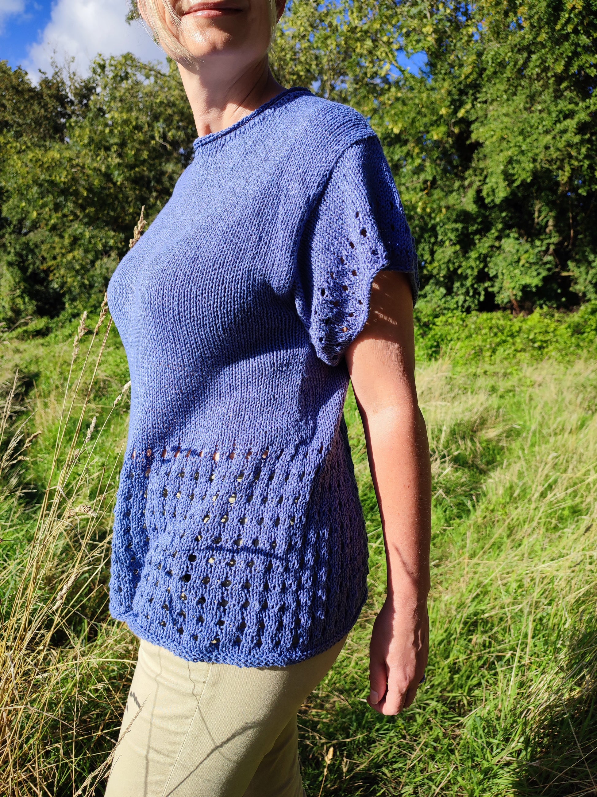 woman wearing lace eyelet tee knitting pattern in field