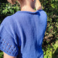 woman showing rolled neckline of lace eyelet Oceans Edge Tee
