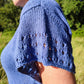 woman showing close up of eyelets on sleeve of OceansEdge Tee
